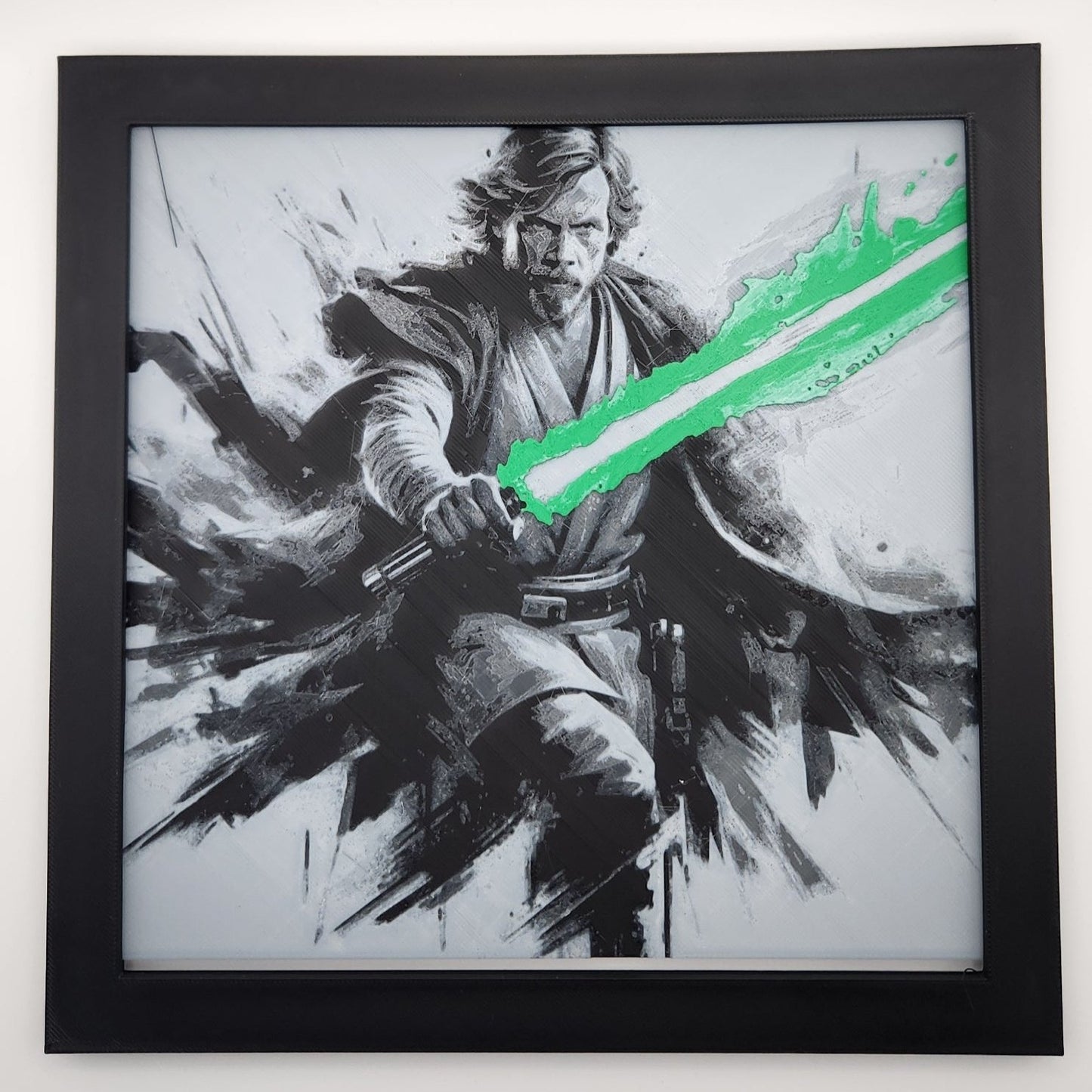 Luke holding a green lightsaber with frame