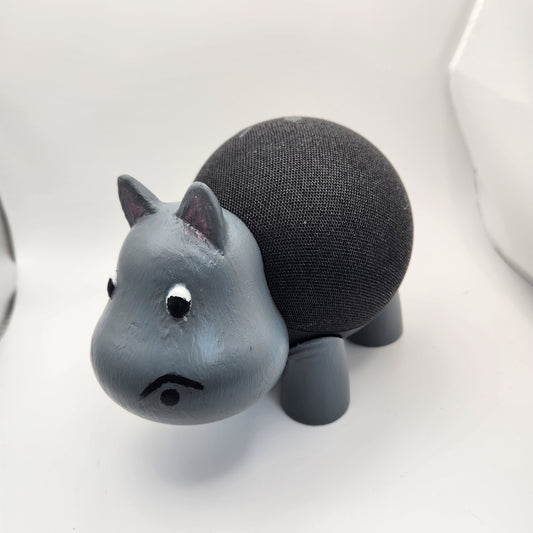 A 3D printed gray hippo figure with a round black speaker as its body.